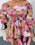 Short floral dress with ruffles made from cotton and polyester, suitable for summer days, with bright floral design and gentle details.