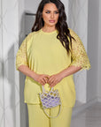 Conjunto de blusa y pantalón de encaje