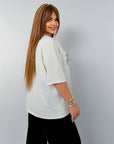 Knitwearен комплект с надпис NewYear25, 80% cotton, 15% polyester, 5% elastane, изображение на дрехи.
