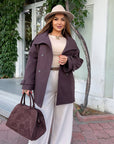 Short cashmere coat with warm lining in set, polyester and viscose, model against a white background.
