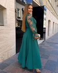 Long embroidered dress made from polyester, model SV082025, shown on mannequin, with graceful details and elegant design.