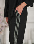 Комплект Linen trousers with decorative stones  и linenти, произведен от Composition linen 80% и polyester 20%.