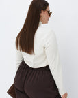 Soft turtleneck jumper in beige, from fabric with cotton, viscose and elastane, suitable for everyday style.
