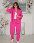 Комплект Linen trousers with decorative stones , 80% linen и 20% polyester, изображение на елегантен модел.