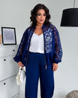 Set with a mesh bomber jacket, composition of polyester, viscose and spandex, model with sheer mesh elements and modern look