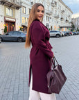Long faux cashmere coat with polyester, viscose and wool, in beige, on model, showing style and comfort.
