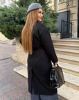 Long faux-cashmere coat with polyester, viscose and wool, model with classic cut and elegant design.