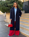 Long faux-cashmere coat in a blend of polyester, viscose and wool, model with classic design and cut.