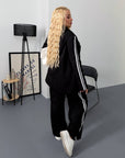 Blazer and wide-leg trouser set from the IT brand, polyester, viscose and spandex, image of a model with clothing.