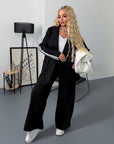 Blazer and wide-leg trouser set from IT with polyester, viscose and spandex, style shown on a model with modern design.