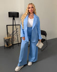 Blazer and wide-leg trouser set in IT style, polyester, viscose and spandex, worn on a model.