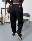 Corduroy trousers from an Italian brand, with viscose, cotton and elastane, shown on a model.