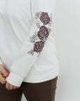 Sweater with appliqué