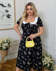 Vestido midi con cuello llamativo
