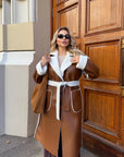 Long faux leather coat, 100% polyamide, with a fashionable design and cut, suitable for cold weather.