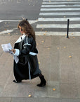 Long faux leather coat, 100% polyamide, stylish design, in black, shown on a model.