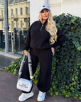 Fleece set with wide-leg trousers in polyester and elastane, comfortable and warm, shown in the image.