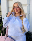 Fleece set with wide-leg trousers in polyester and elastane, image of a model showing comfortable clothing for cold weather.