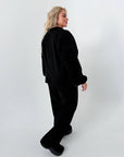 Warm fleece set in polyester and elastane, shown in the image, suitable for winter and sports activities.
