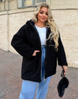 Short faux fur coat in polyester and acrylic, waist-length, shown in the image.