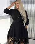 Flared dress with cut-outs and stones, in polyester, viscose and spandex, for elegant style and comfort.