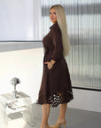 Flared dress with cut-outs and stones, polyester and viscose, suitable for elegant occasions.
