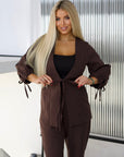 Elegant embellished dress in polyester, viscose and spandex, with detailed stones across the body.