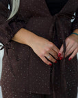 Elegant embellished dress, polyester, viscose and spandex, suitable for special occasions.