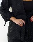 Elegant embellished dress in polyester, viscose and spandex, shown on a model.