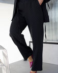 Elegant embellished dress in polyester, viscose and spandex, with a graceful design and stone details.