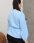 V-neck blouse in viscose and polyester, an elegant women's piece in white.