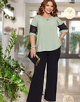 Blouse and wide-leg pants set  от polyester, lycra и nylon, с елегантен и комфортен дизайн.