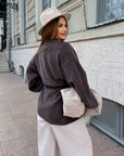 Cropped cardigan with a belt made from polyester and viscose, beige, model with fitted silhouette and fashionable design.