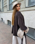 Cropped cardigan with a belt made from polyester and viscose, image of a model, worn stylish fashion cardigan.