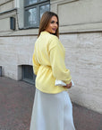 Cropped cardigan with a belt made from cotton and polyester, model from Composition, with fashionable design and cut.