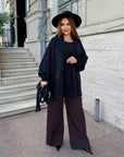 Cropped cardigan with a belt made from polyester and viscose, model with elegant design and adjustment with a belt, in the photo.