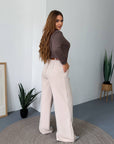 Women's wide-leg trousers made from polyester, viscose and spandex, image of fashion model.