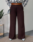 Women's wide-leg trousers, polyester, viscose and spandex, lying on bed, in beige.