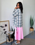 Checked shirt with a belt made from cotton and polyester, image of a model, worn stylish and comfortable everyday garment.