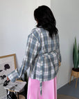 Checked shirt with a belt made from cotton and polyester, model with long sleeves and classic design, suitable for everyday style.