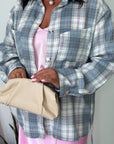 Checked shirt with a belt made from cotton and polyester, shown in the image with details on the design and fabric.