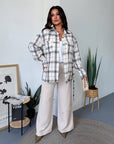Checked shirt with a belt made from cotton and polyester, with fashionable design, shown in the photo.