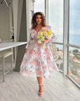 Миди рокля от organza с цветен принт, polyester 100%, показана на снимка.